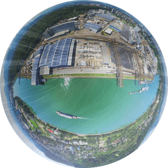 Aerial view of maritime ports and wind turbines.