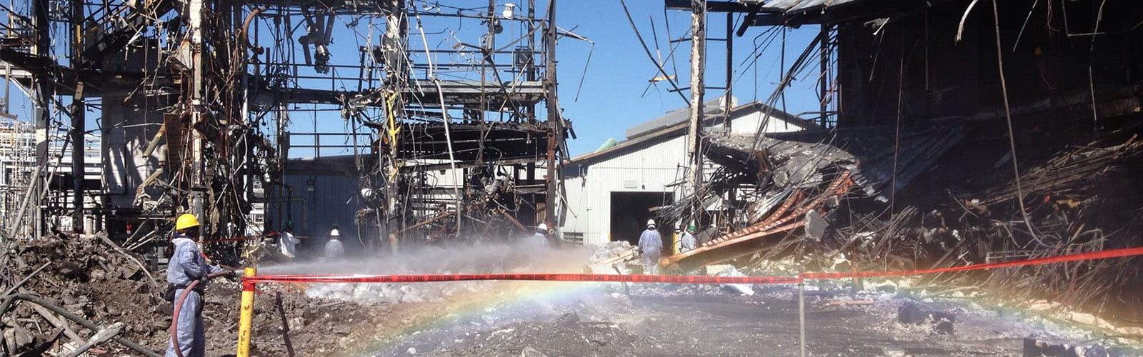 Wetting material during pickup asbestos clean up at a contaminated site